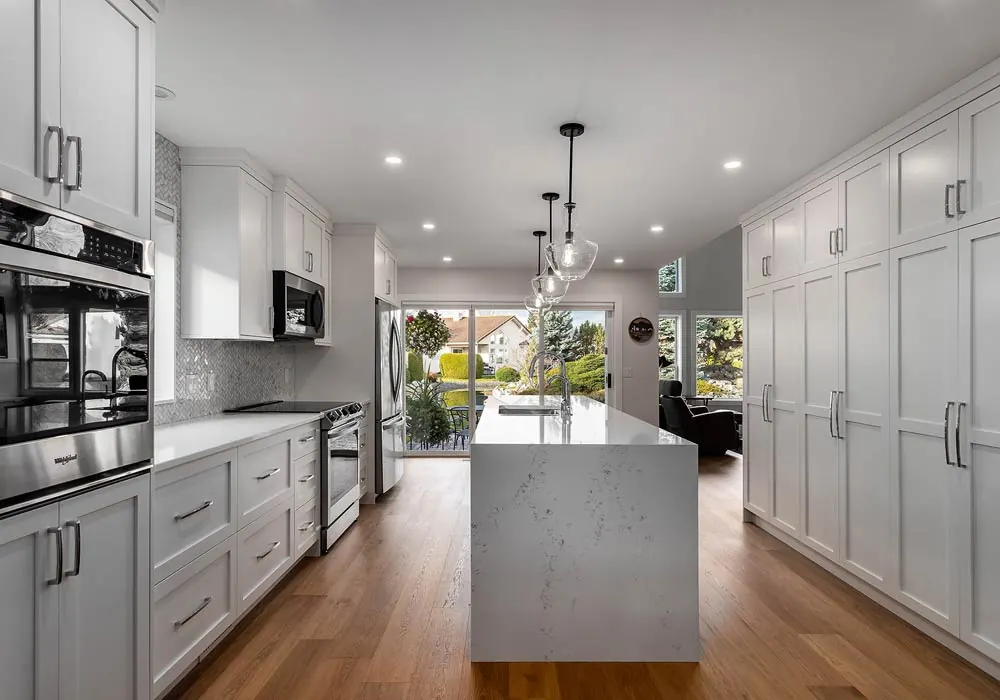 Custom kitchen and living room by Amend Developments